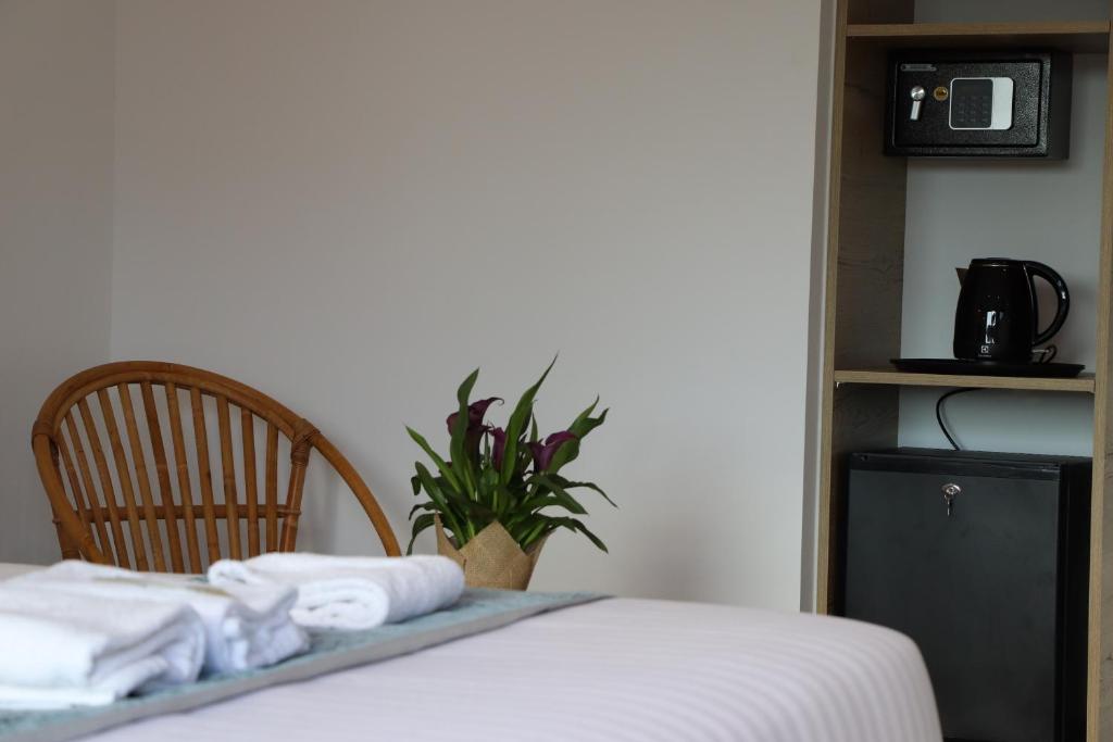Postel nebo postele na pokoji v ubytování Hotel Fazio