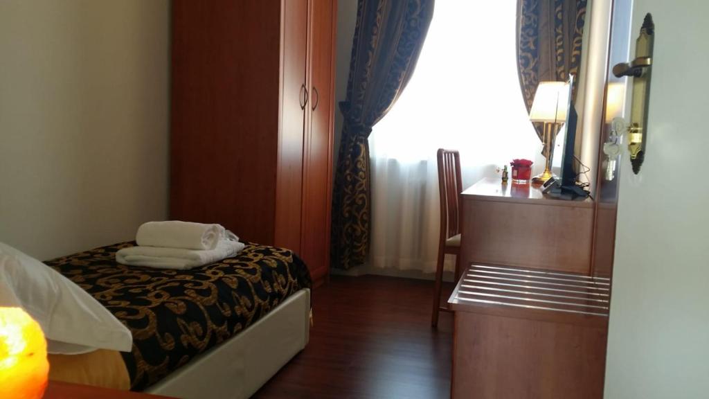 Voodi või voodid majutusasutuse Carpe Diem Ancona toas