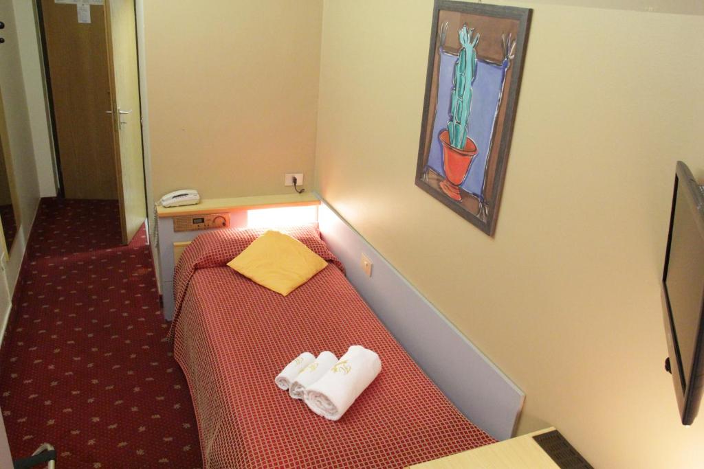 Telewizja i/lub zestaw kina domowego w obiekcie Hotel Lugano