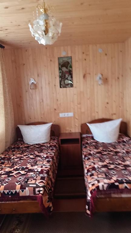 Postel nebo postele na pokoji v ubytování raduga karpat