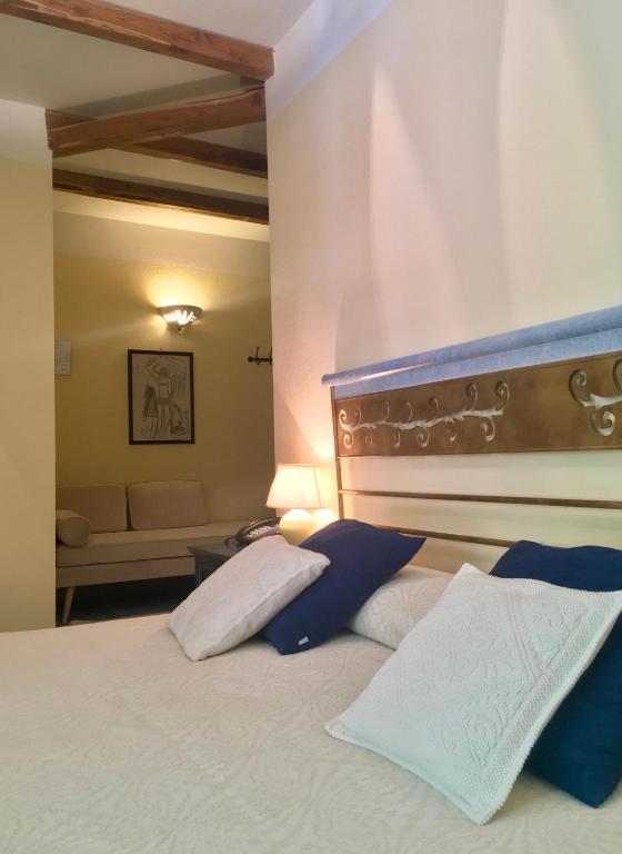Postel nebo postele na pokoji v ubytování Hotel Su Lithu