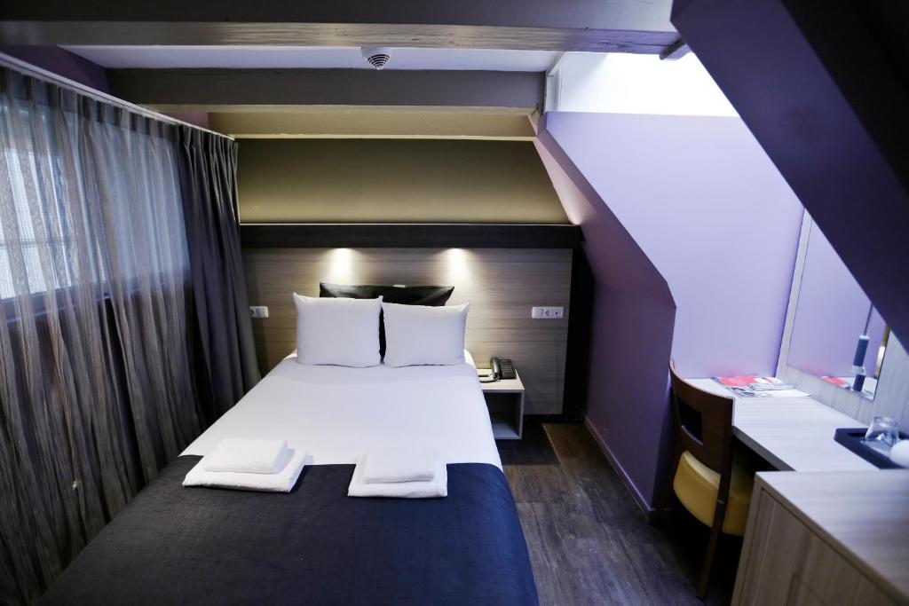 Postel nebo postele na pokoji v ubytování City Hotel Amsterdam