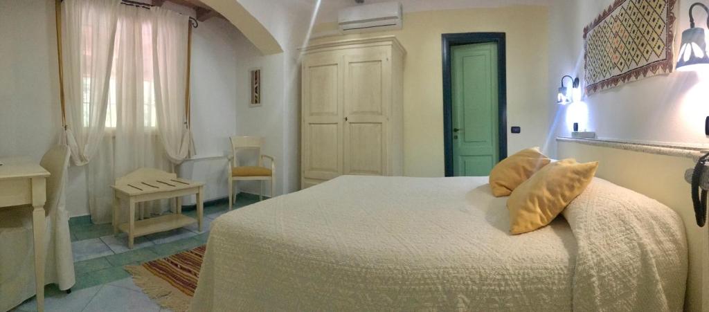 Postel nebo postele na pokoji v ubytování Hotel Su Lithu
