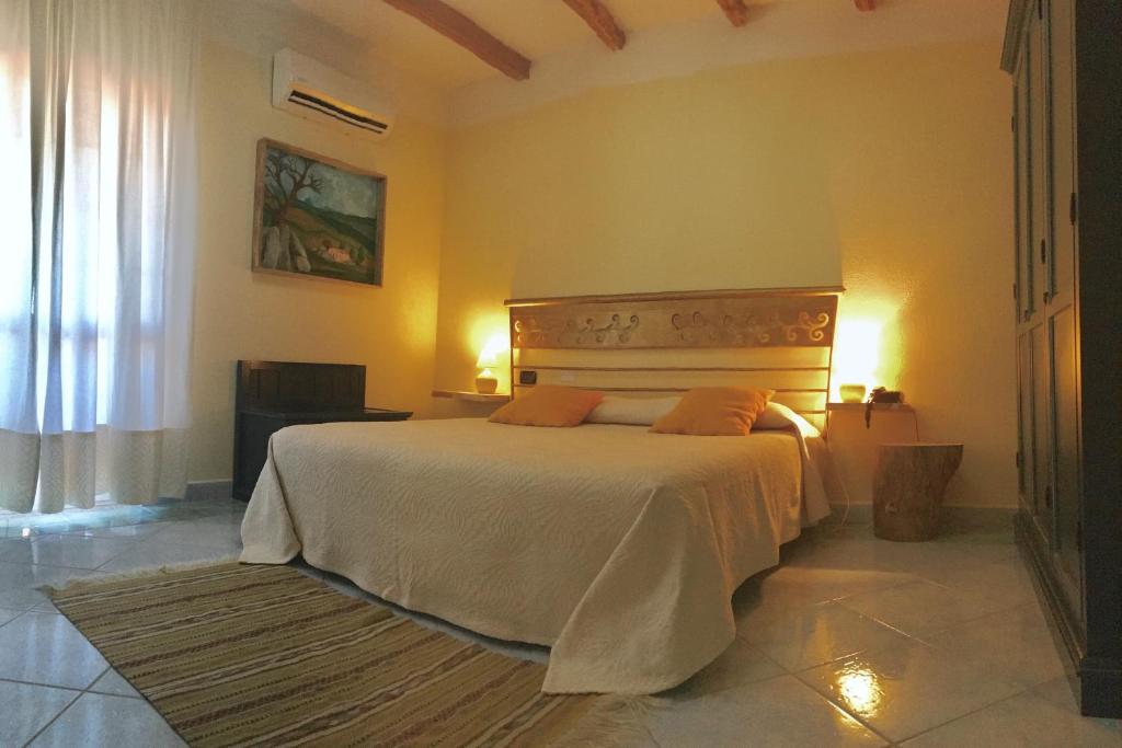 Postel nebo postele na pokoji v ubytování Hotel Su Lithu