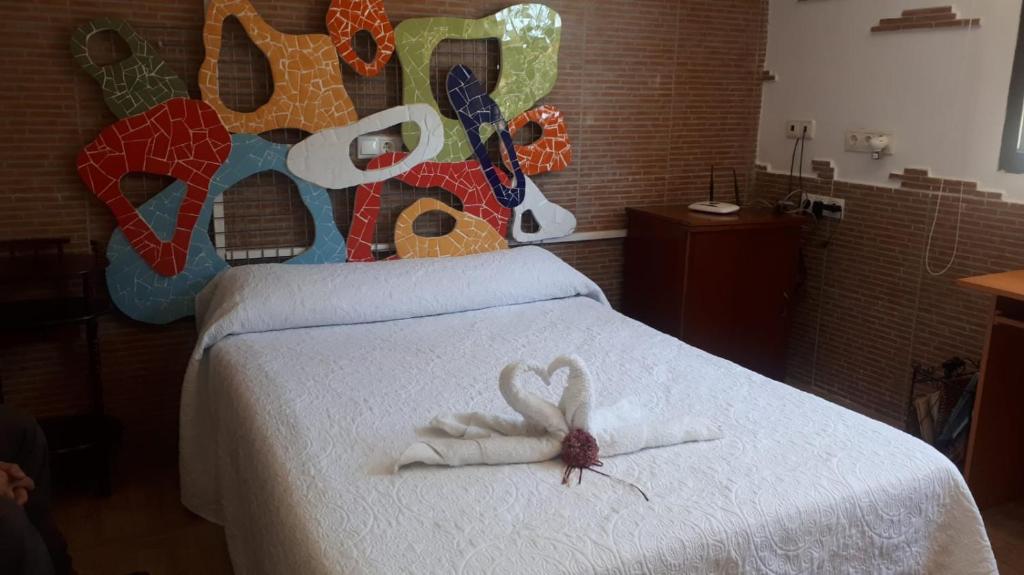 A bed or beds in a room at "La Chacra" Casa Típica Valenciana