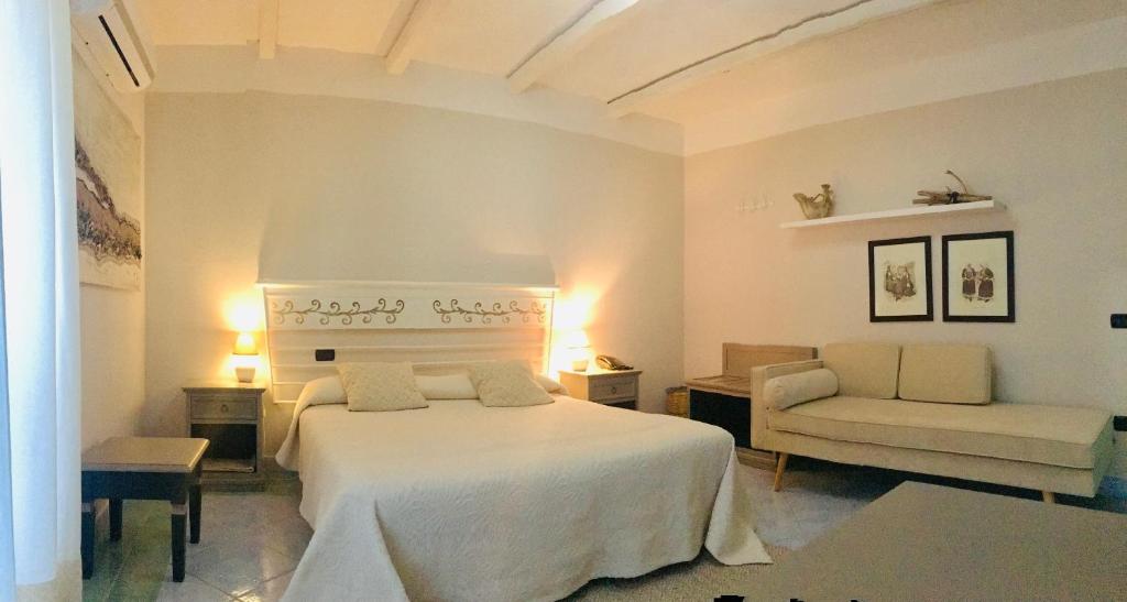 Postel nebo postele na pokoji v ubytování Hotel Su Lithu