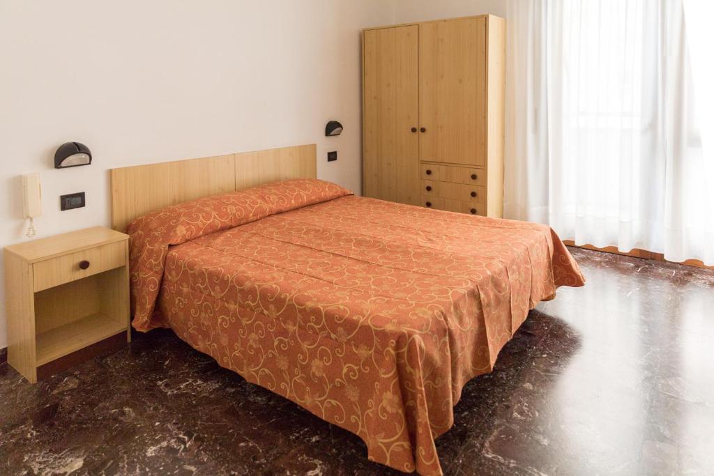 Postel nebo postele na pokoji v ubytování Hotel Sabrina
