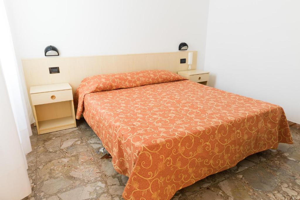 Postel nebo postele na pokoji v ubytování Hotel Sabrina