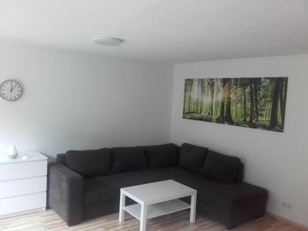 a living room with a couch and a table at Ferienwohnung Zechner in Waidring