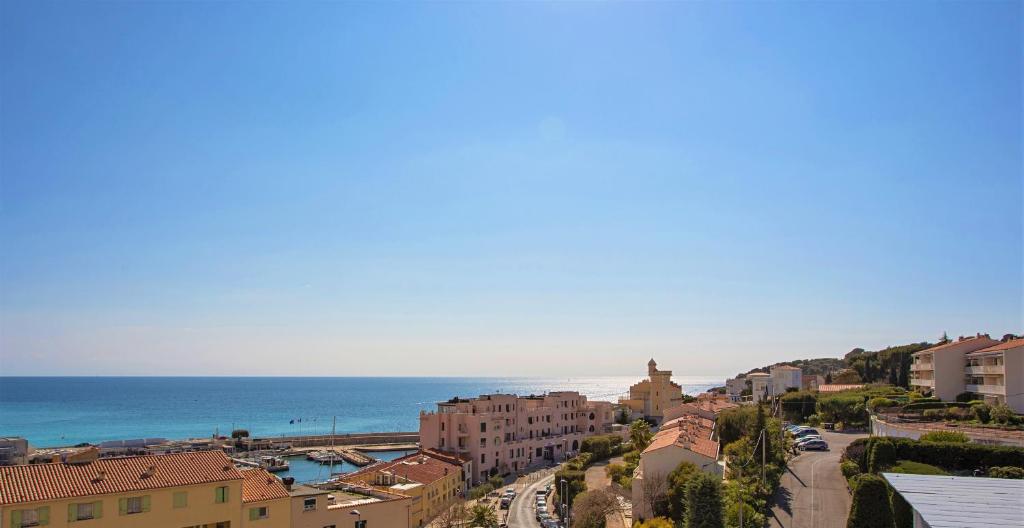 an aerial view of a city and the ocean at SunRise Cassis in Cassis