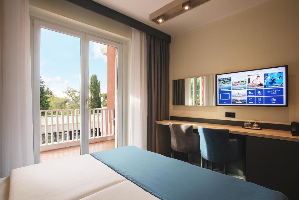Postel nebo postele na pokoji v ubytování Hotel Haliaetum - San Simon Resort