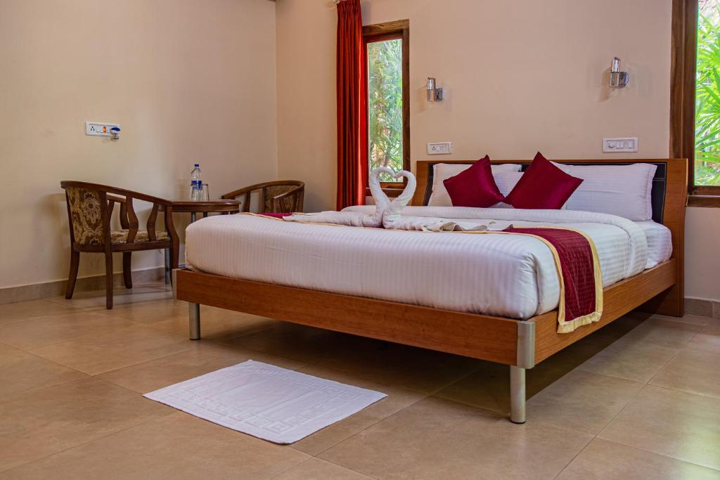 Postel nebo postele na pokoji v ubytování Orchid Trails Resort