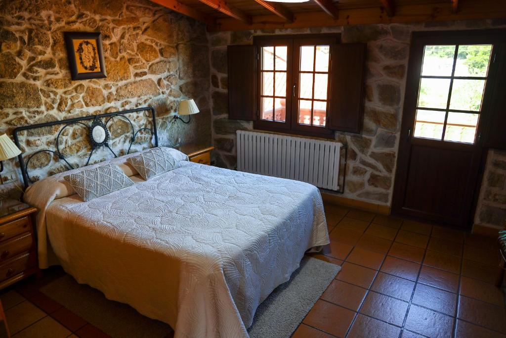 Postel nebo postele na pokoji v ubytování Casa Raúl Lires