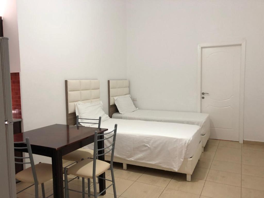 Postel nebo postele na pokoji v ubytování Hotel Alina