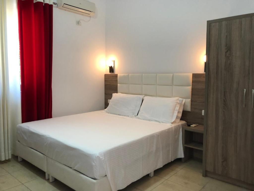 Postel nebo postele na pokoji v ubytování Hotel Alina
