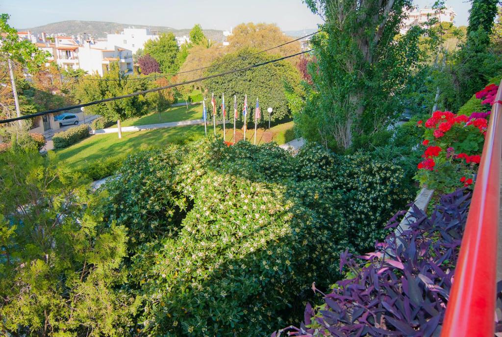 a view from a balcony of a garden with flowers at Apollonia Hotel Apartments in Varkiza