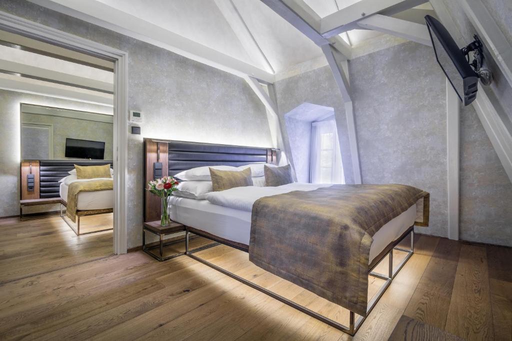 Postel nebo postele na pokoji v ubytování Hotel Waldstein