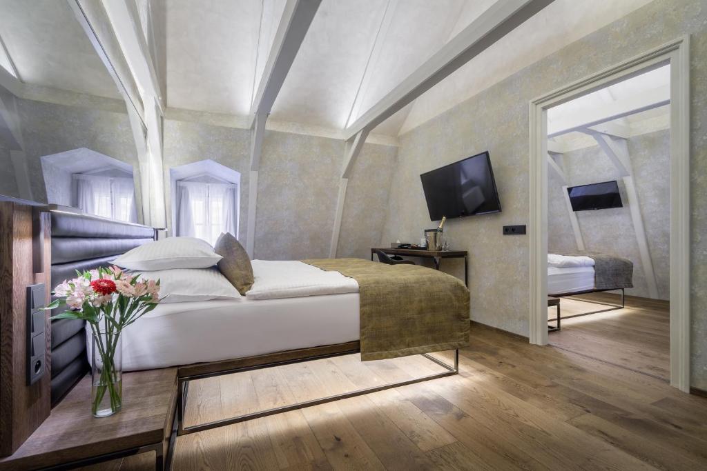 Postel nebo postele na pokoji v ubytování Hotel Waldstein