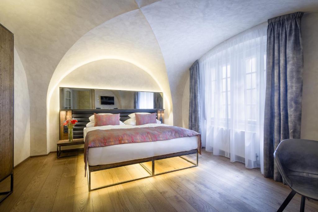 Postel nebo postele na pokoji v ubytování Hotel Waldstein