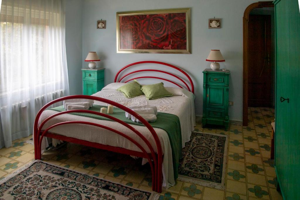 Łóżko lub łóżka w pokoju w obiekcie Casa vacanze Gioia