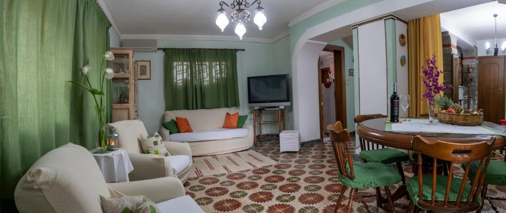 Telewizja i/lub zestaw kina domowego w obiekcie Casa vacanze Gioia