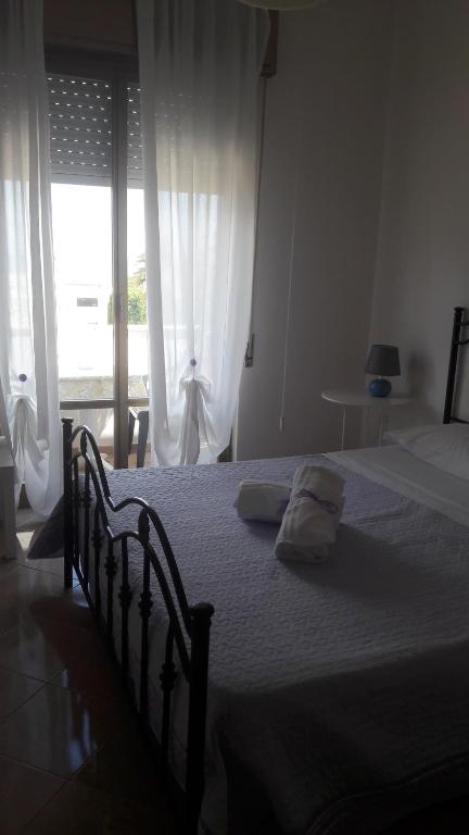 Postel nebo postele na pokoji v ubytování Villa Midolo