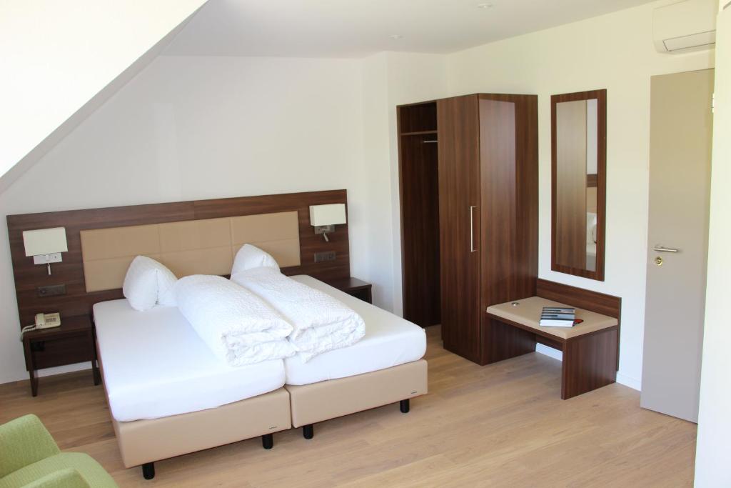 Postel nebo postele na pokoji v ubytování Seehotel Delphin