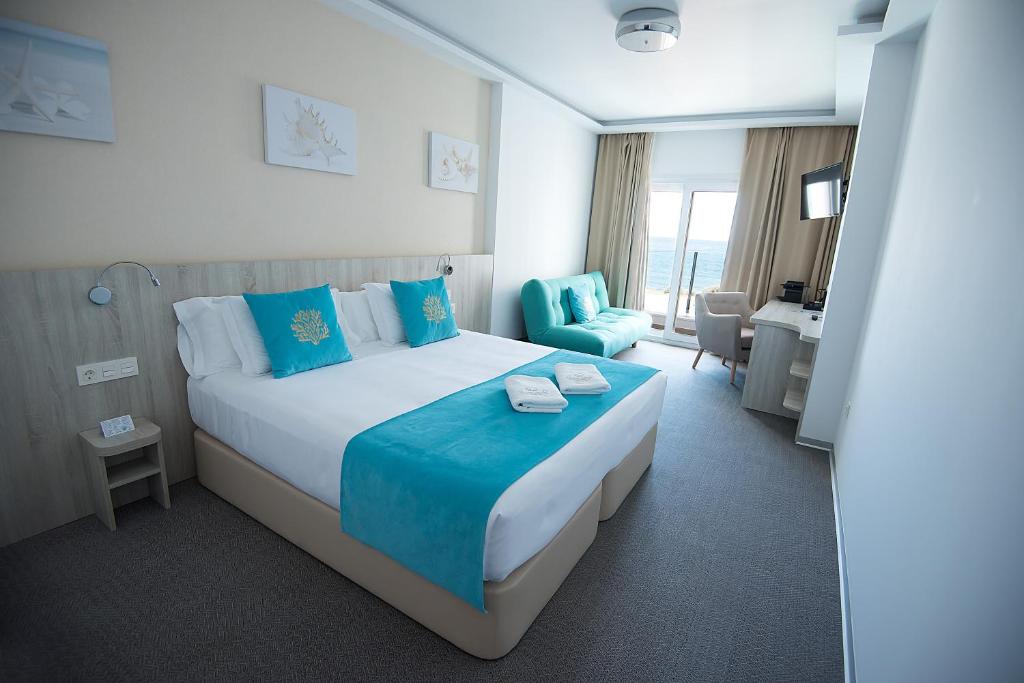 Postel nebo postele na pokoji v ubytování Hotel Soul de Javea