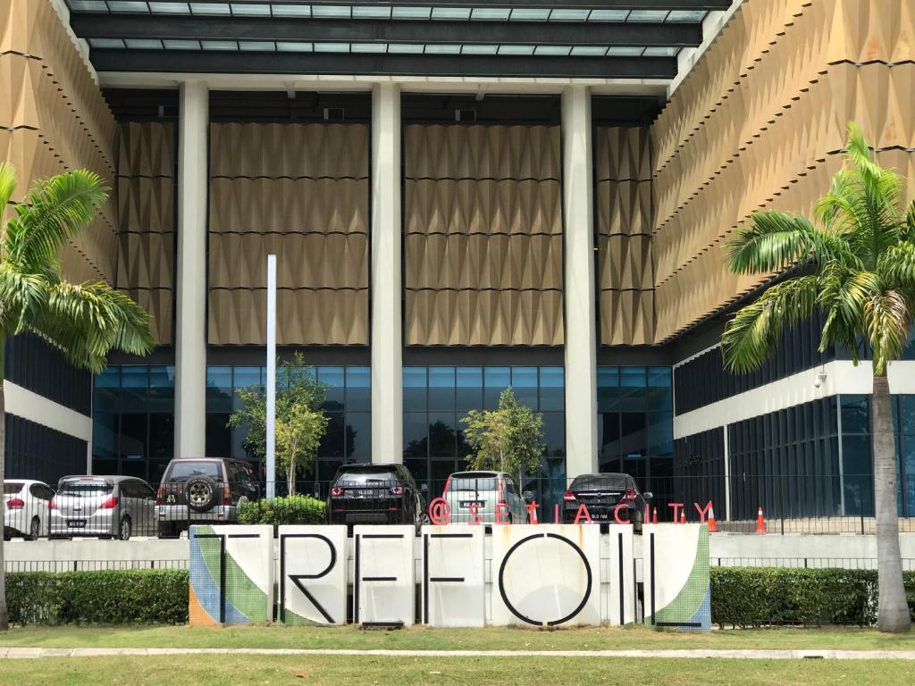 a sign in front of a car dealership at CozyStudio Trefoil Setia Alam in Shah Alam