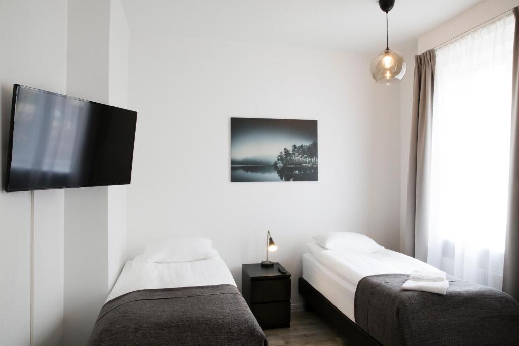 Postel nebo postele na pokoji v ubytování Fosshotel Rauðará
