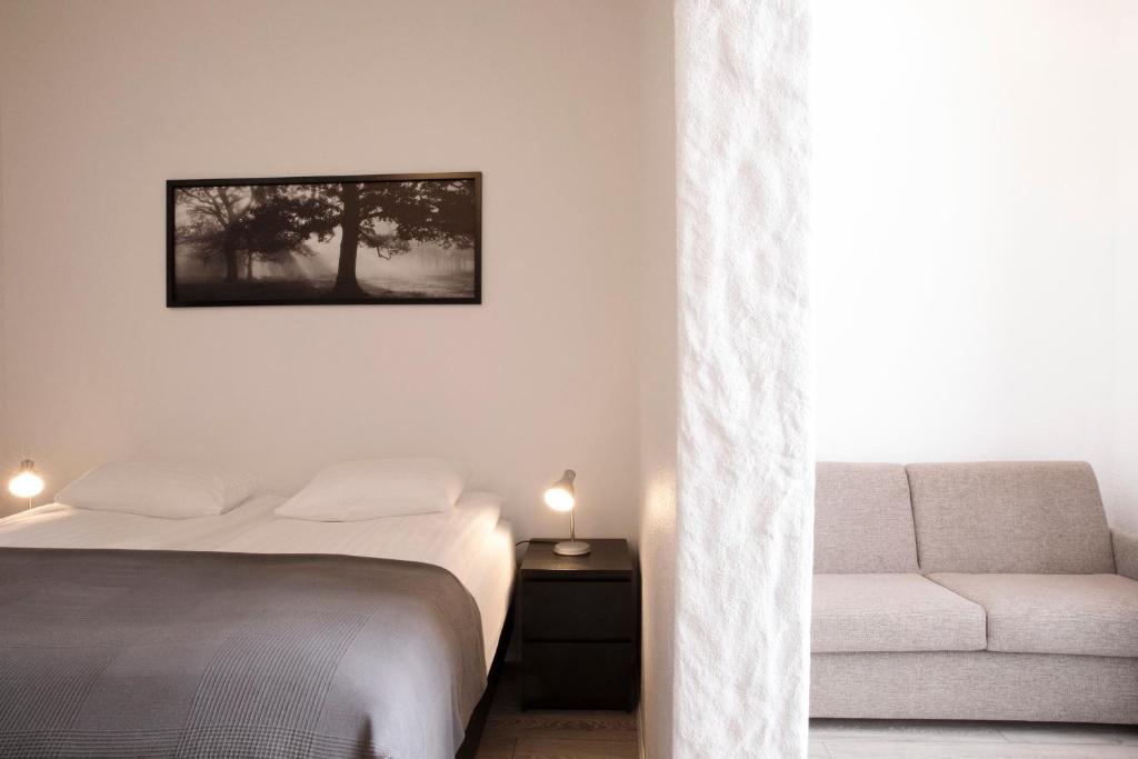 Rúm í herbergi á Fosshotel Rauðará
