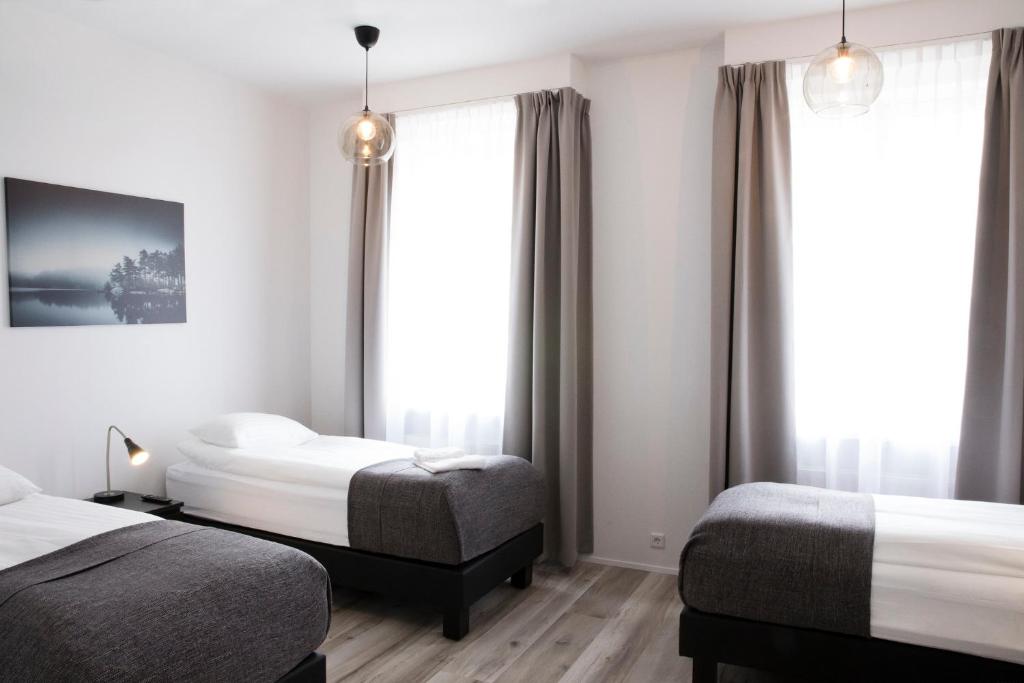 Rúm í herbergi á Fosshotel Rauðará