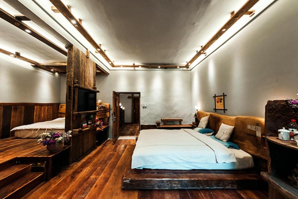 Postel nebo postele na pokoji v ubytování Yunlu Lianxin Guesthouse