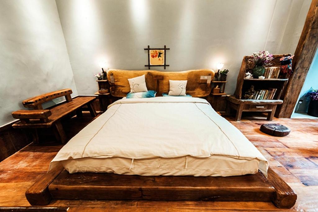Postel nebo postele na pokoji v ubytování Yunlu Lianxin Guesthouse