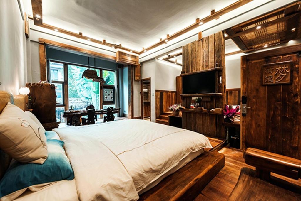 TV a/nebo společenská místnost v ubytování Yunlu Lianxin Guesthouse