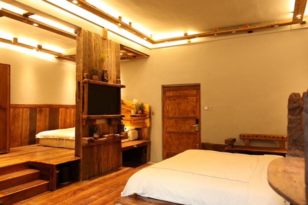 Postel nebo postele na pokoji v ubytování Yunlu Lianxin Guesthouse