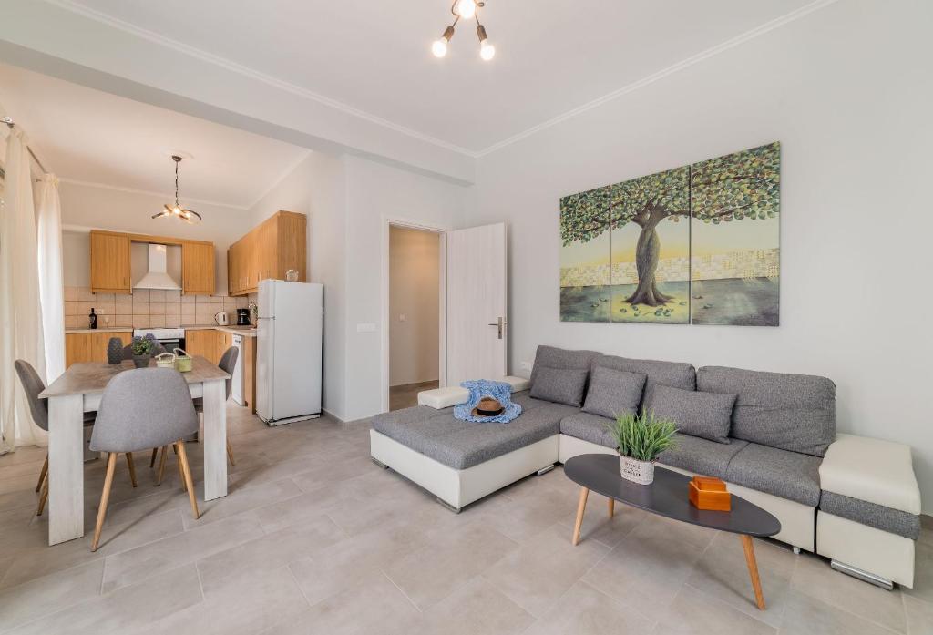 a living room with a couch and a table at Sea La Vie Villa in Zakynthos Town