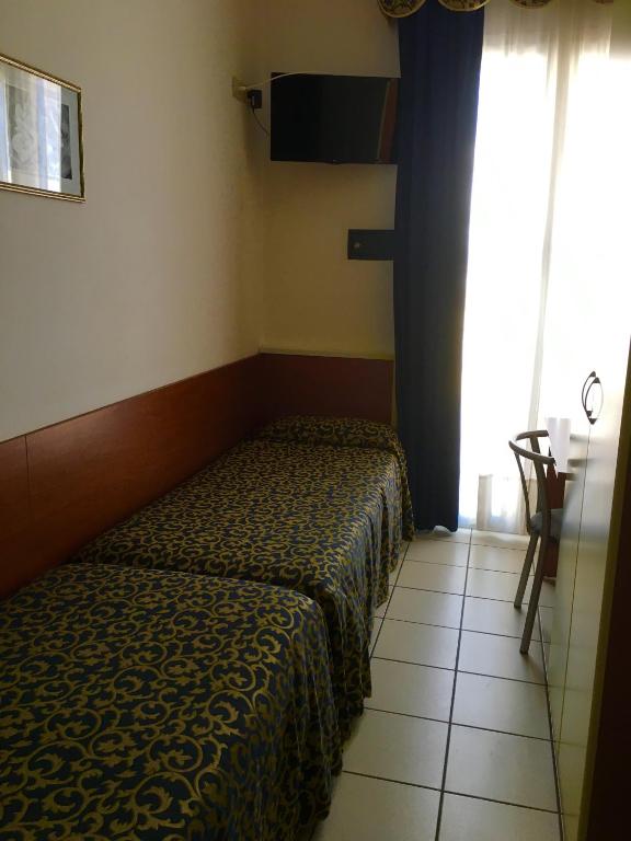 Posteľ alebo postele v izbe v ubytovaní Hotel Lido