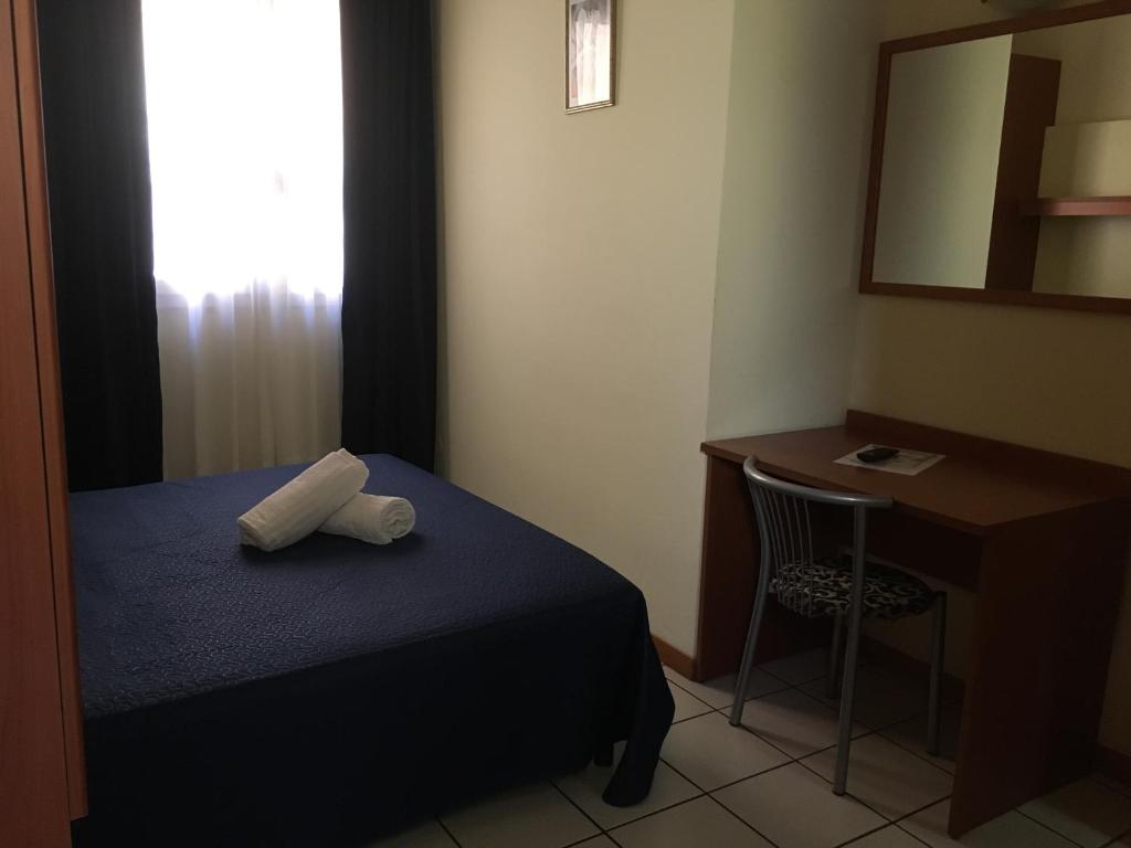 Posteľ alebo postele v izbe v ubytovaní Hotel Lido