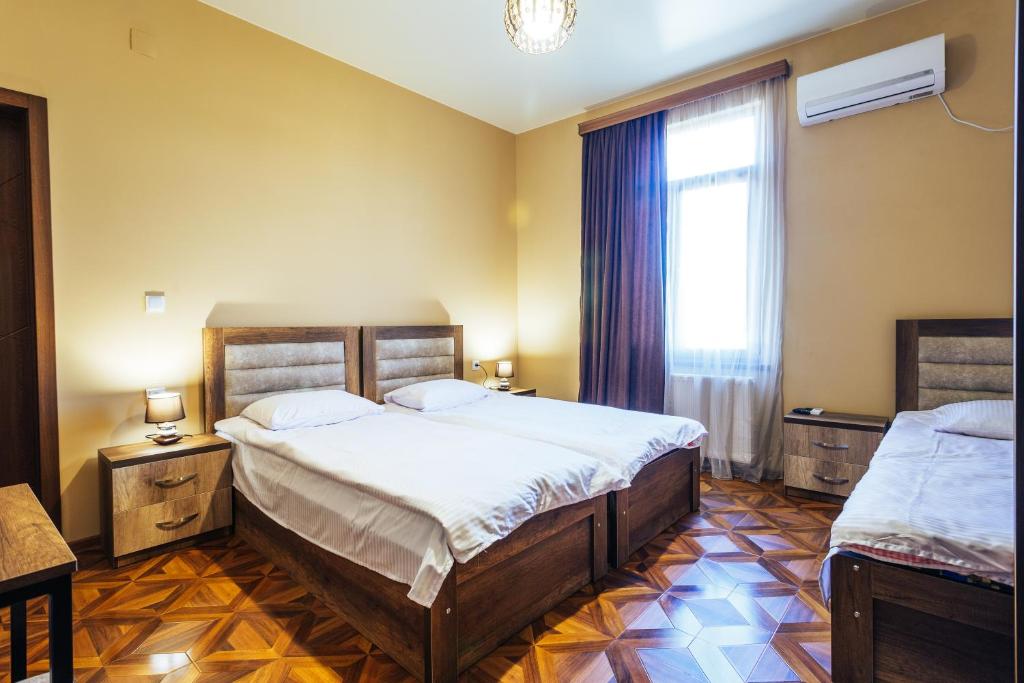 Postel nebo postele na pokoji v ubytování Memory House
