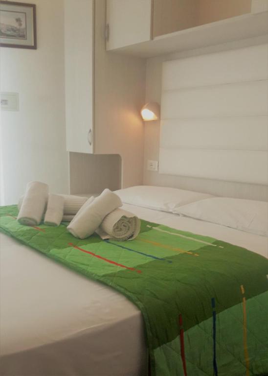 A bed or beds in a room at Hotel Imperiale