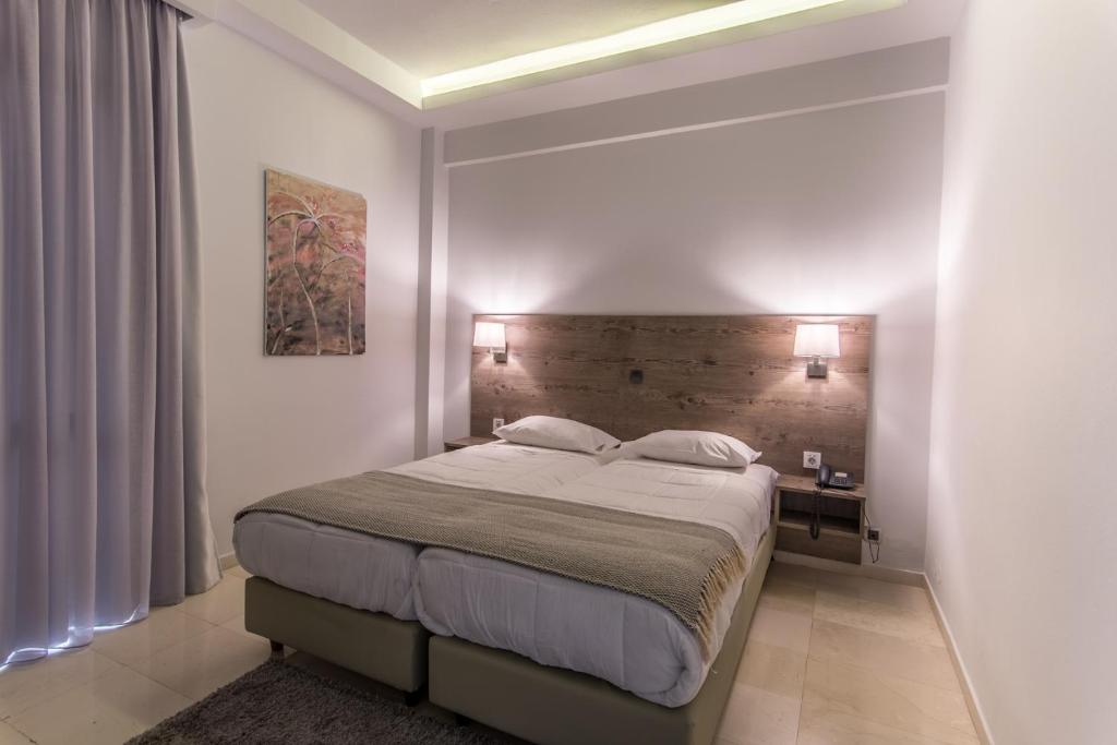 Postel nebo postele na pokoji v ubytování Hotel Metropol