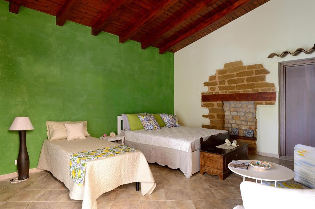 Postel nebo postele na pokoji v ubytování LUMIE DI SICILIA