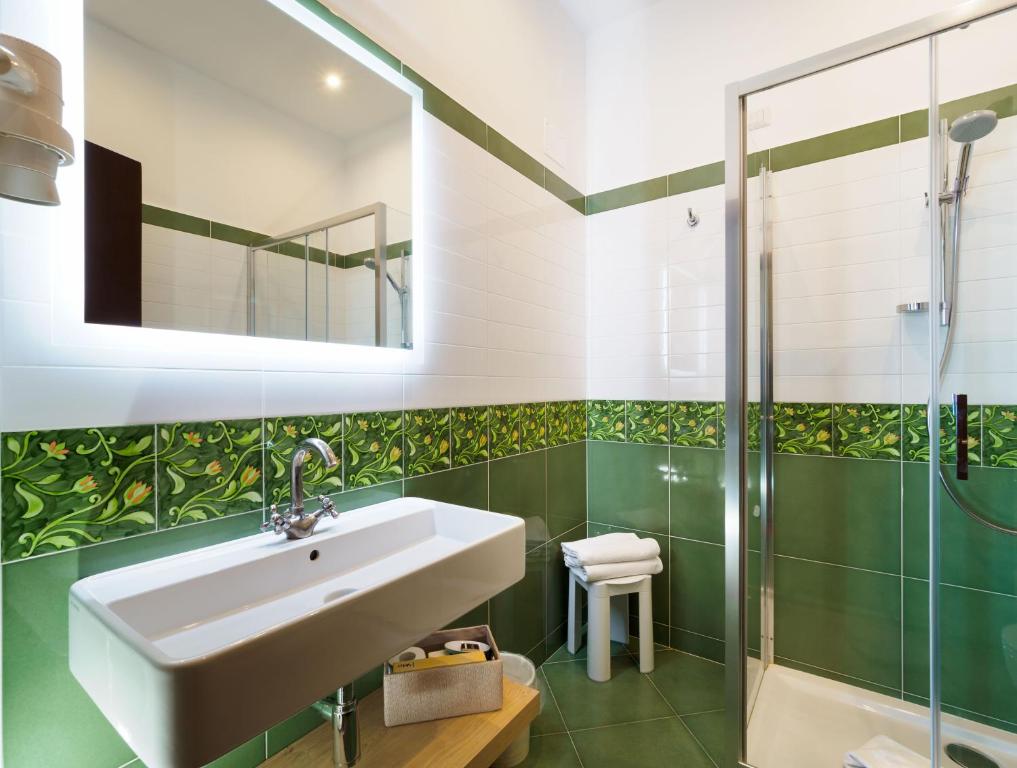 a bathroom with a sink and a shower at Hotel Sirius in Taormina