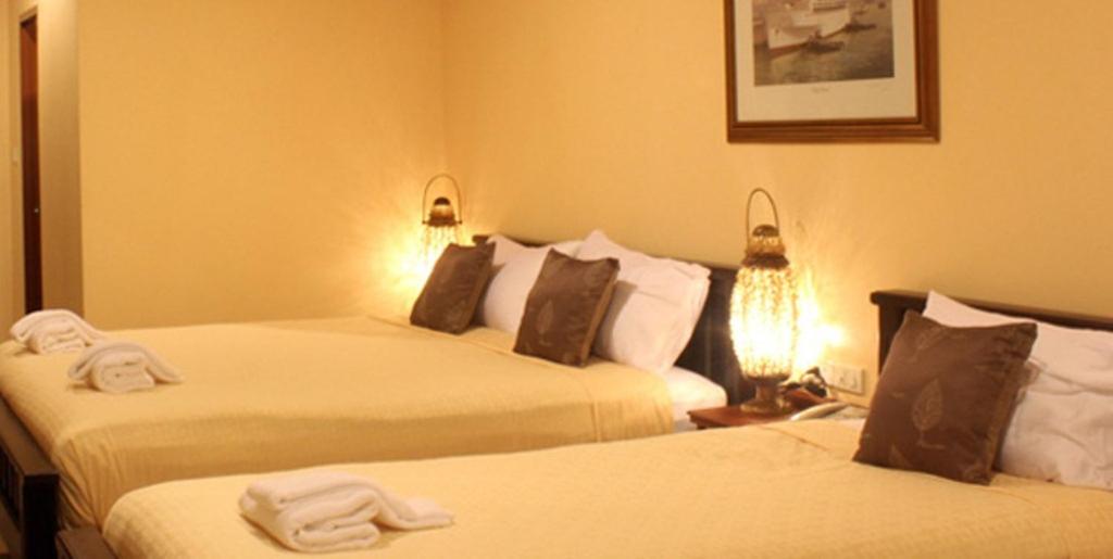 Postel nebo postele na pokoji v ubytování Baanmalai Hotel Chiangrai