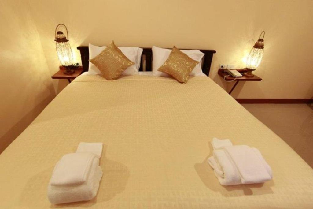 Postel nebo postele na pokoji v ubytování Baanmalai Hotel Chiangrai