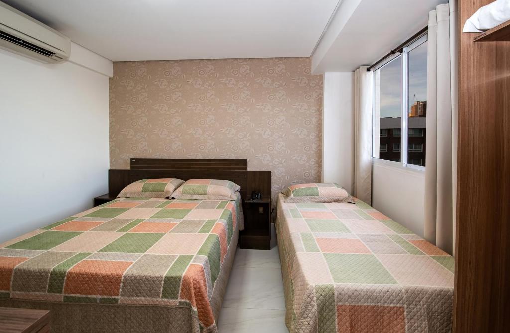 Cama ou camas em um quarto em Tambau Beach Hotel