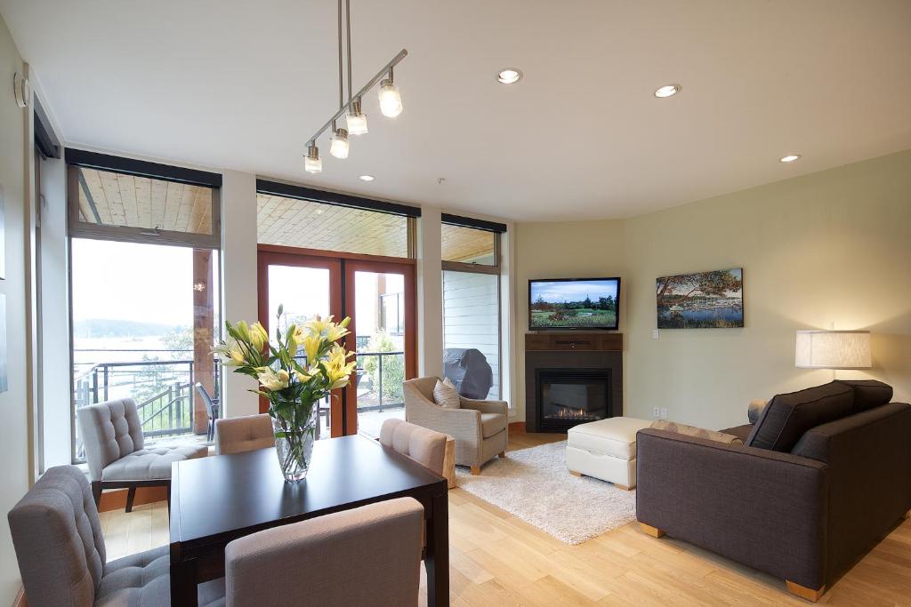 a living room with a vase of flowers on a table at Mariner's Loft in Ganges