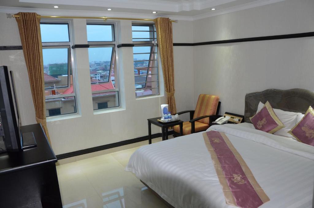 Postel nebo postele na pokoji v ubytování Salita Hotel