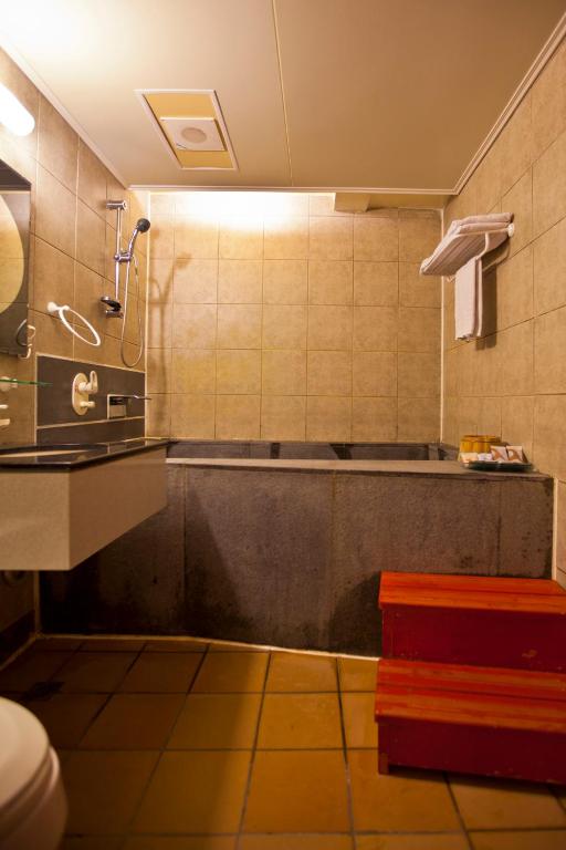 Koupelna v ubytování Tian Long Hotel